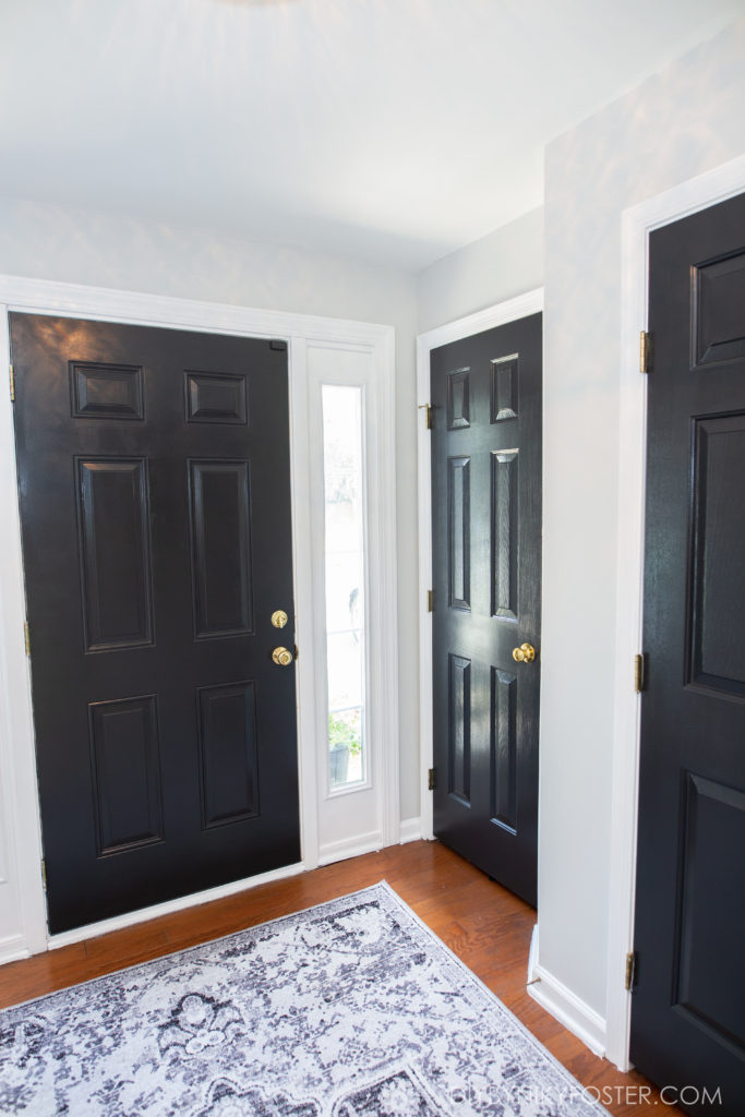 black doors in entryway